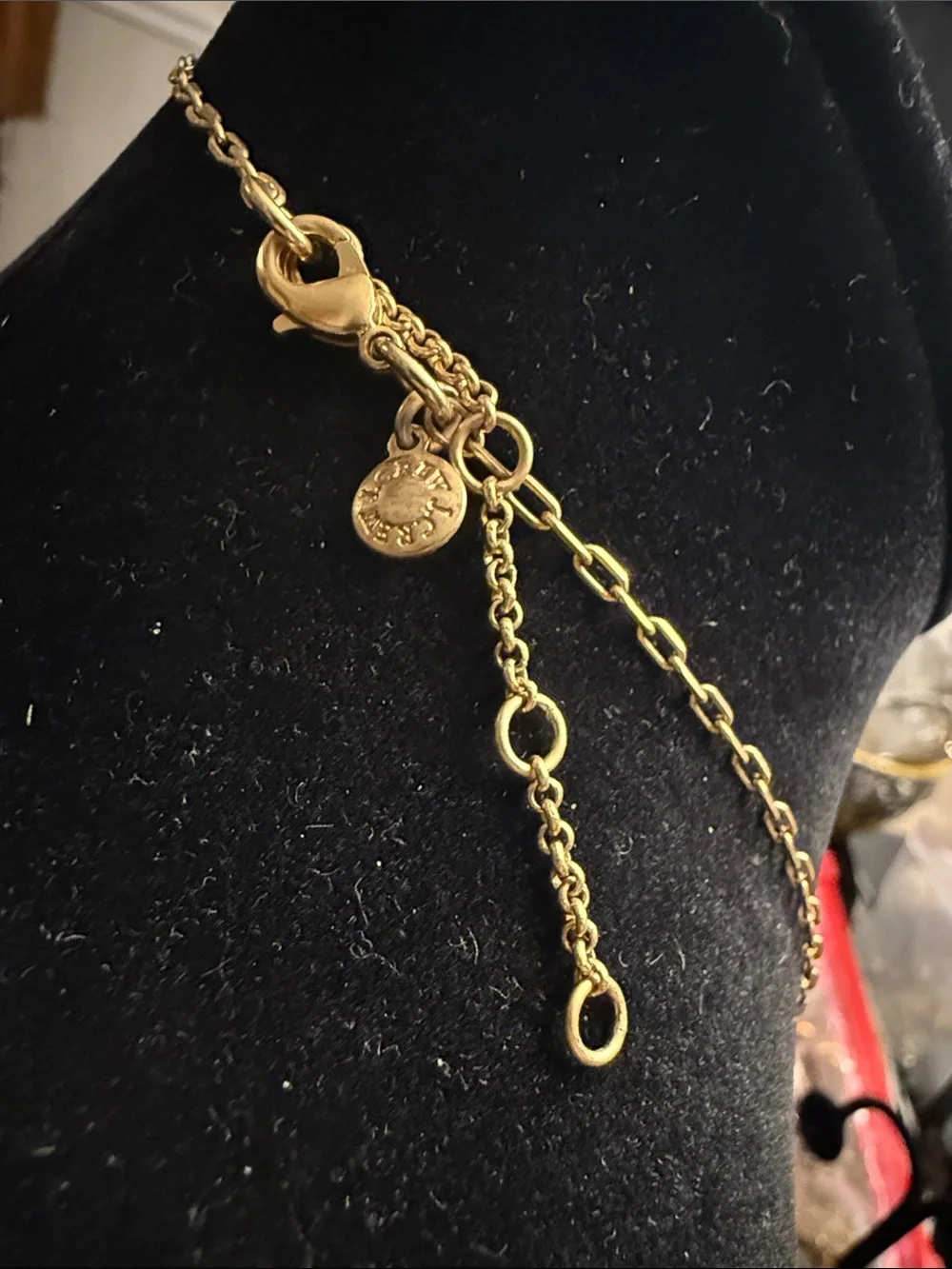 Vintage J.Crew gold tone, black fabric, tassel, and rhinestone pendant necklace